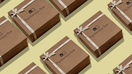 Bulk eco-friendly Diwali gift hampers for employees stacked with branded sleeves.