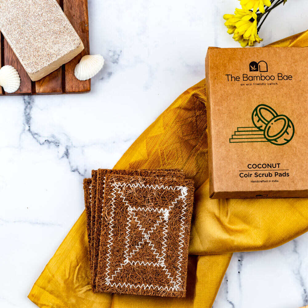 Pack of 4 natural coconut coir scrubs – eco-friendly cleaning pads for kitchen and household use.