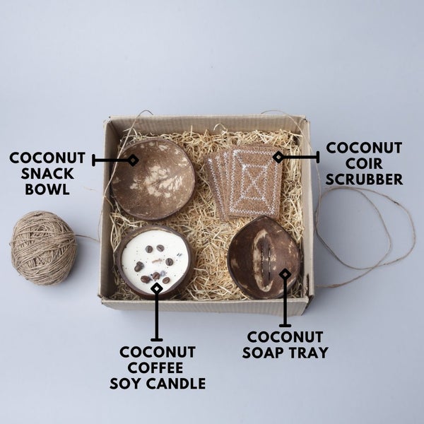 Eco-friendly hamper with coconut shell snack bowl, soap tray, soy wax coffee candle, and coir scrub set – sustainable gifting option.
