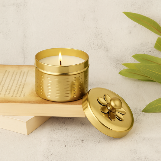 Eco-friendly soy wax candle in premium golden metal jar with floral lid – sustainable festive décor and luxury gifting option.