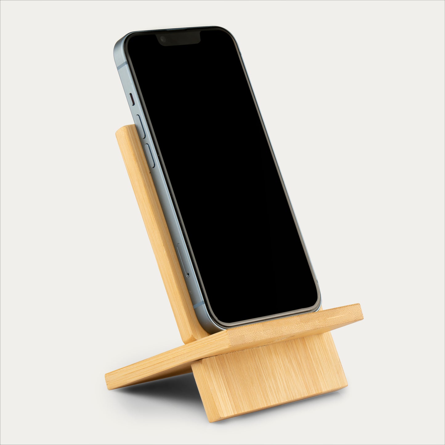 Natural bamboo mobile stand – sustainable phone holder and desk accessory.