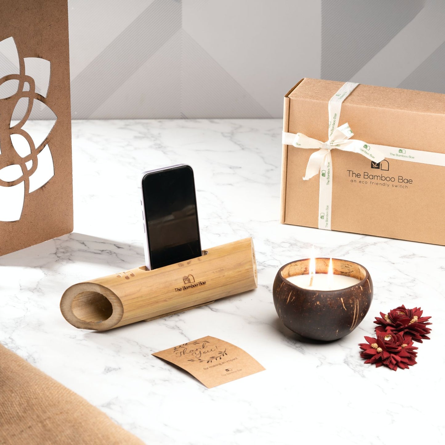 Eco-friendly bamboo mobile stand with natural sound amplifier – sustainable desk accessory for phone holding and music.