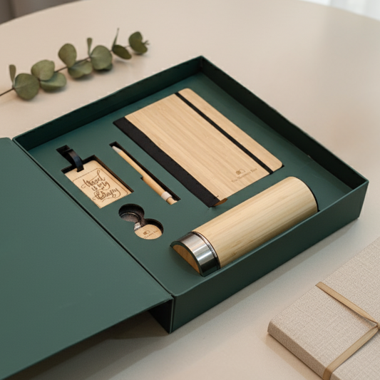 Eco-friendly gift hamper with bamboo diary, bamboo bottle, bamboo pen, and wooden travel tag – sustainable corporate gifting set.