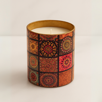 Eco-friendly soy wax candle in mandala design container – festive sustainable décor and gifting option.