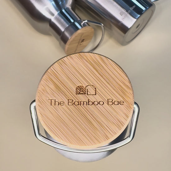 Eco-friendly bamboo lid thermos bottle – double wall 304 stainless steel, reusable hot and cold water bottle available in 350ml, 500ml, and 750ml sizes.
