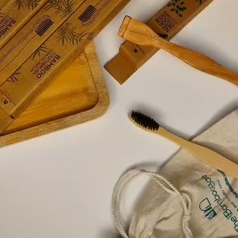 Eco-friendly dental kit with bamboo toothbrush and neem wood tongue cleaner – sustainable oral care combo.
