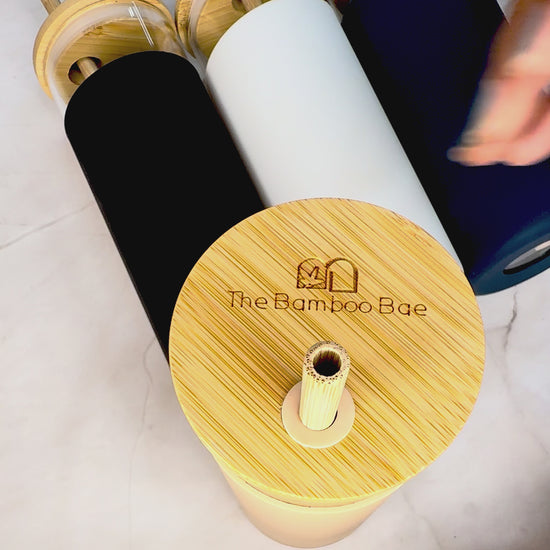 Eco-friendly glass sipper with bamboo lid, straw, and protective sleeve – reusable water bottle and tumbler.