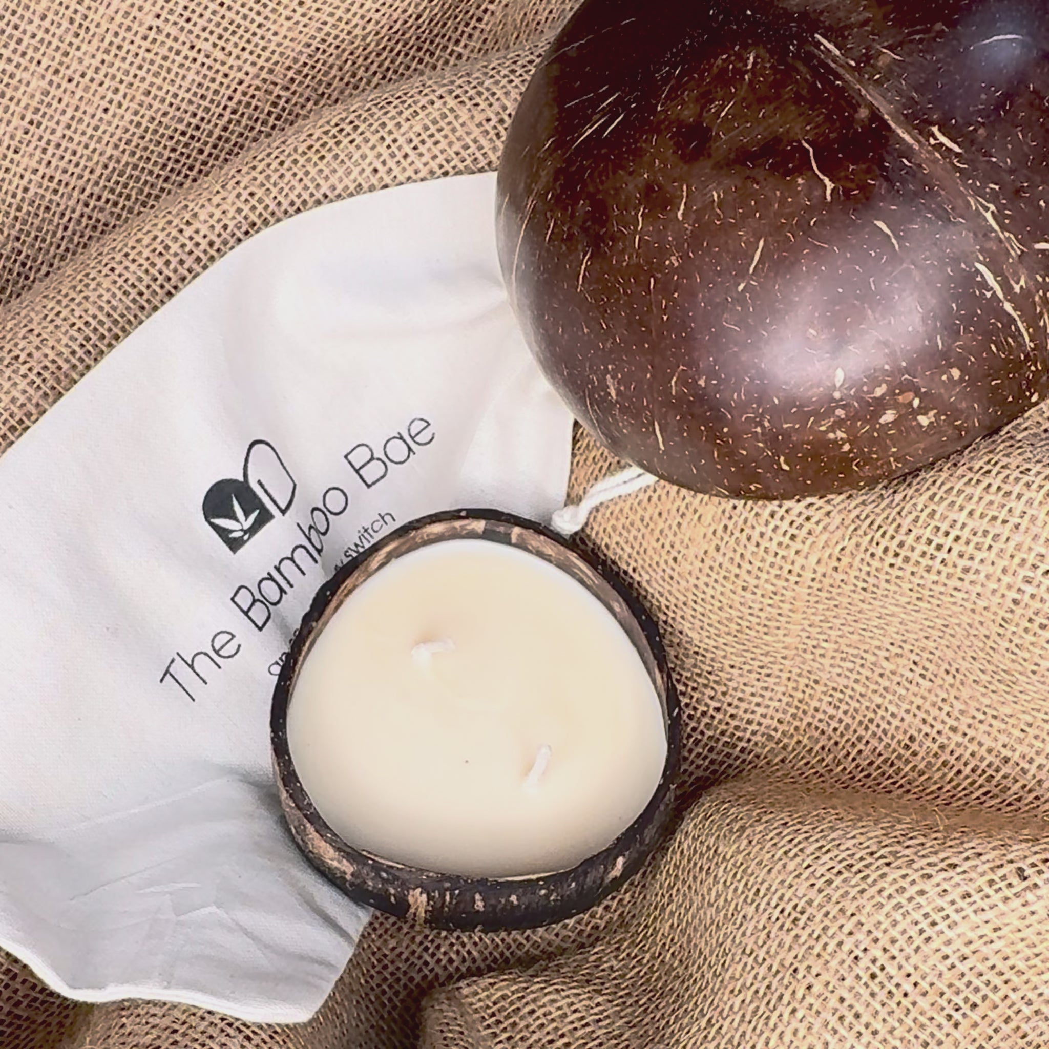 Eco-friendly coconut shell soy wax candle – sustainable handcrafted candle for corporate gifts and festive hampers.
