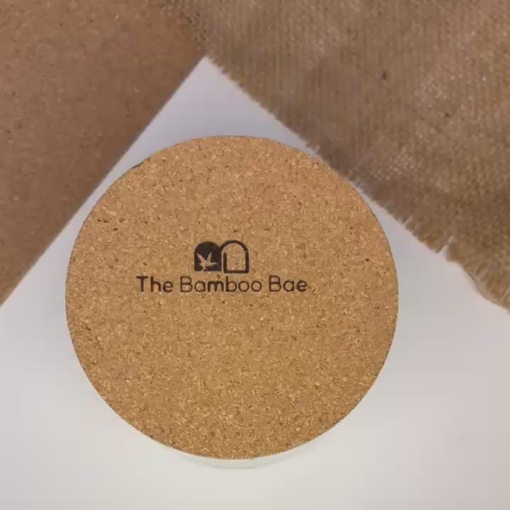 Eco-friendly soy wax candle in reusable glass jar with cork lid – sustainable gifting option by The Bamboo Bae.
