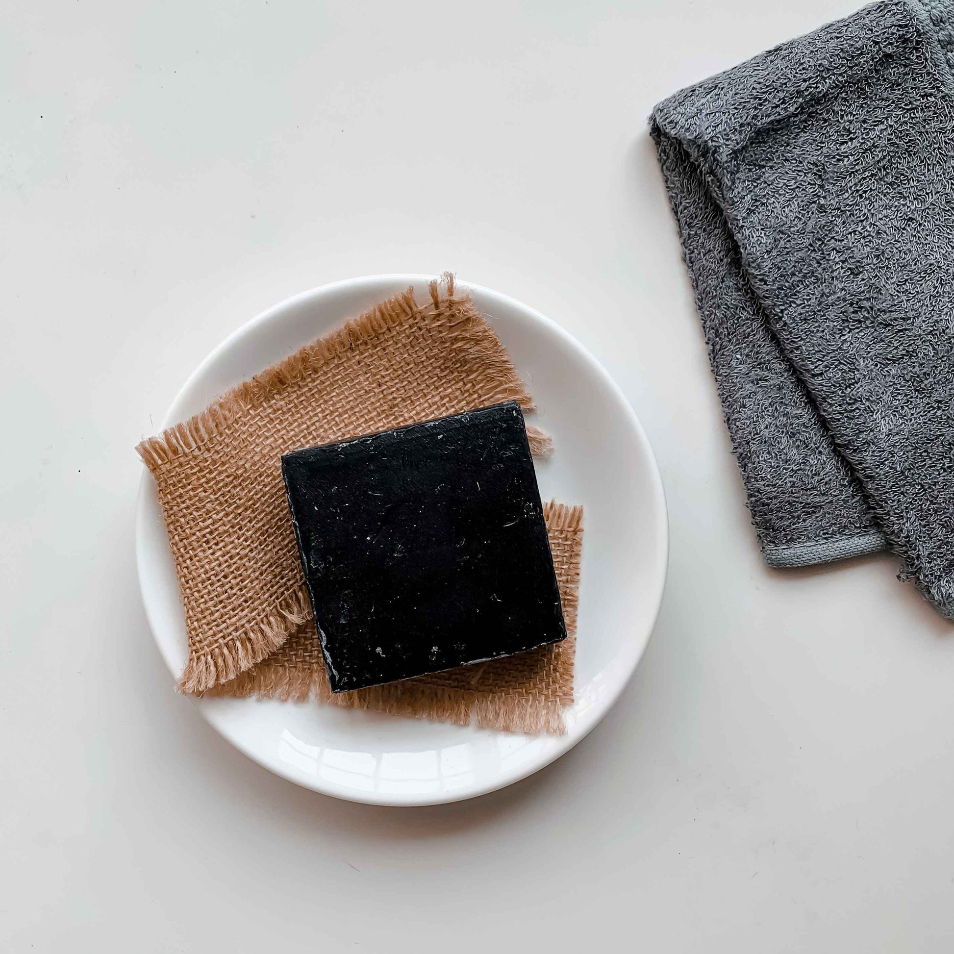 Handmade bamboo charcoal soap with aloe vera, essential oils, and natural glycerin – eco-friendly skincare soap.