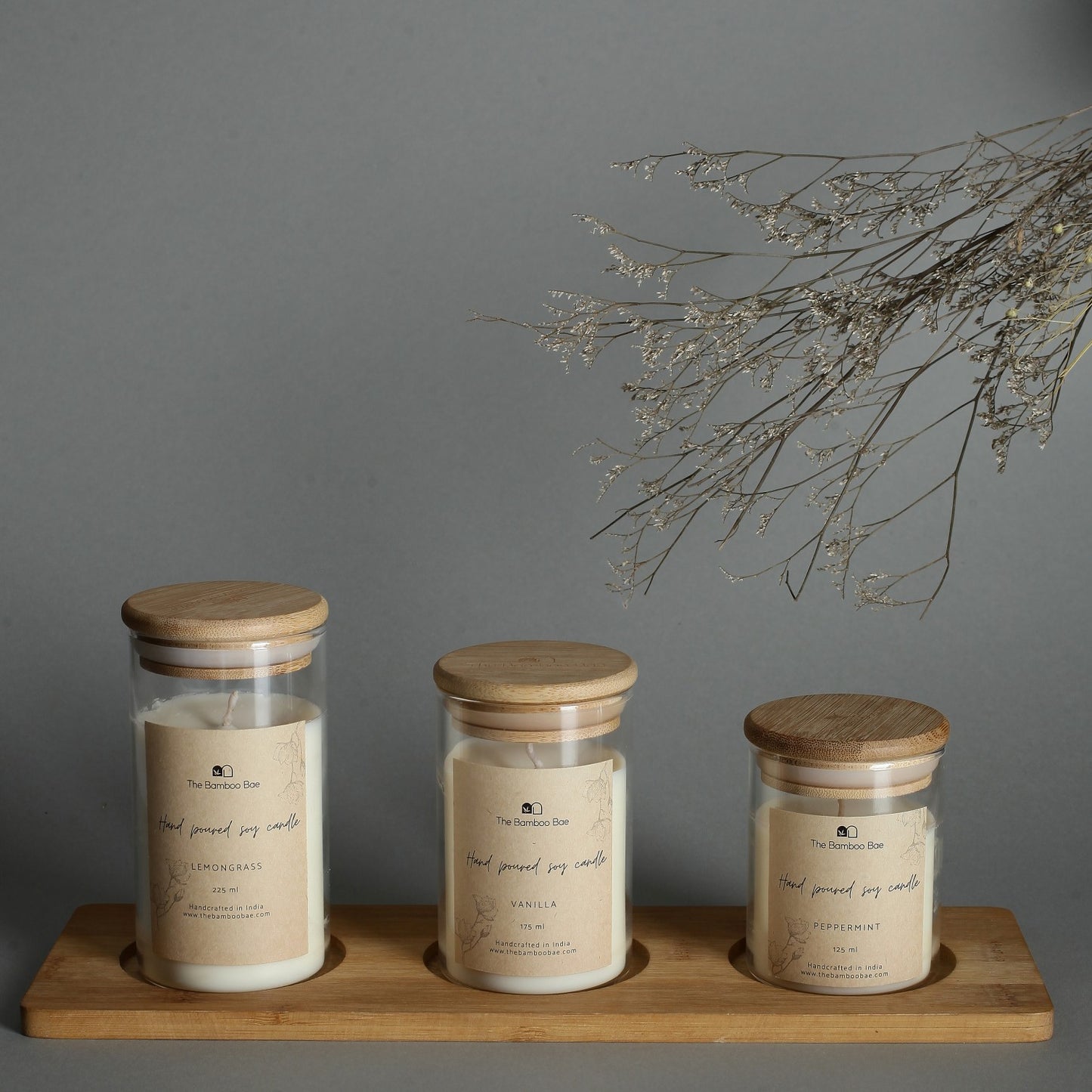 Set of 3 soy wax candles in borosilicate glass jars with bamboo lids – eco-friendly, reusable, and perfect for corporate or festive gifting.