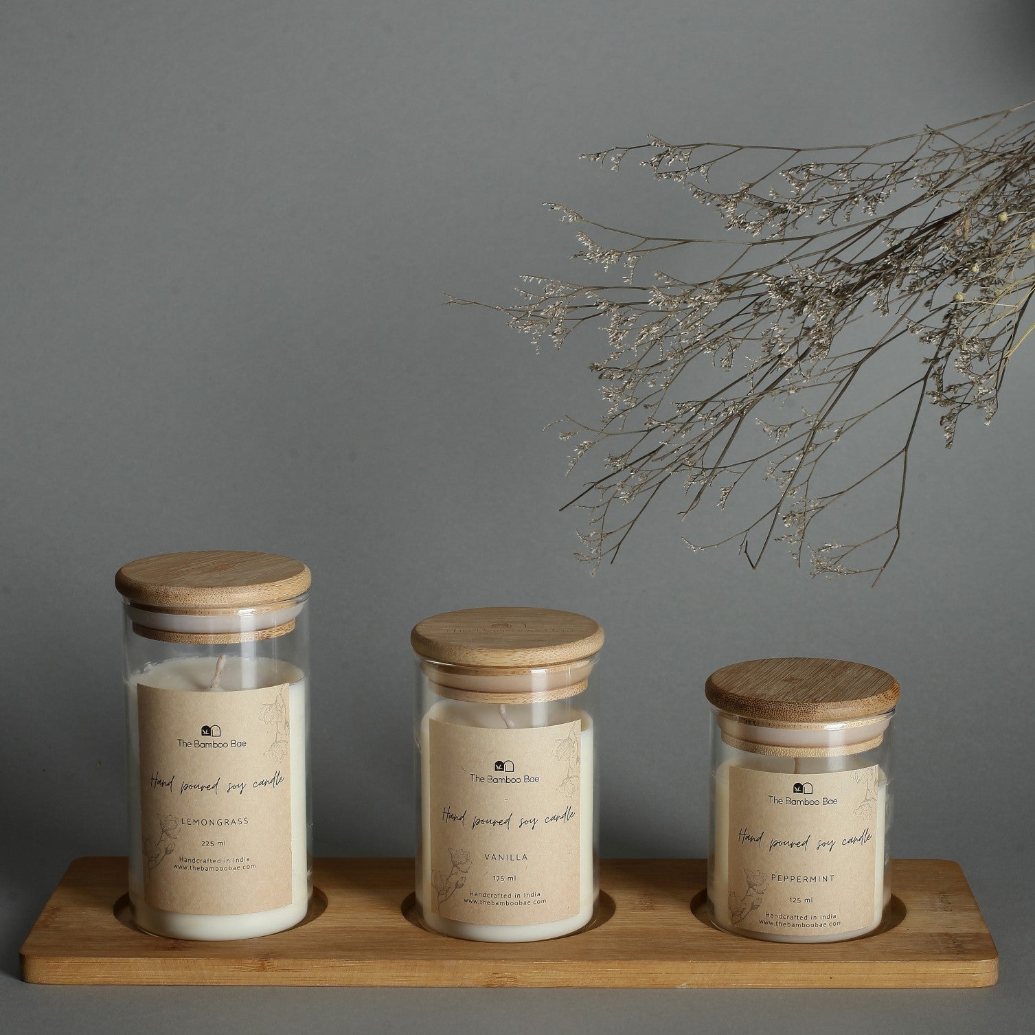 Set of 3 soy wax candles in borosilicate glass jars with bamboo lids – eco-friendly, reusable, and perfect for corporate or festive gifting.