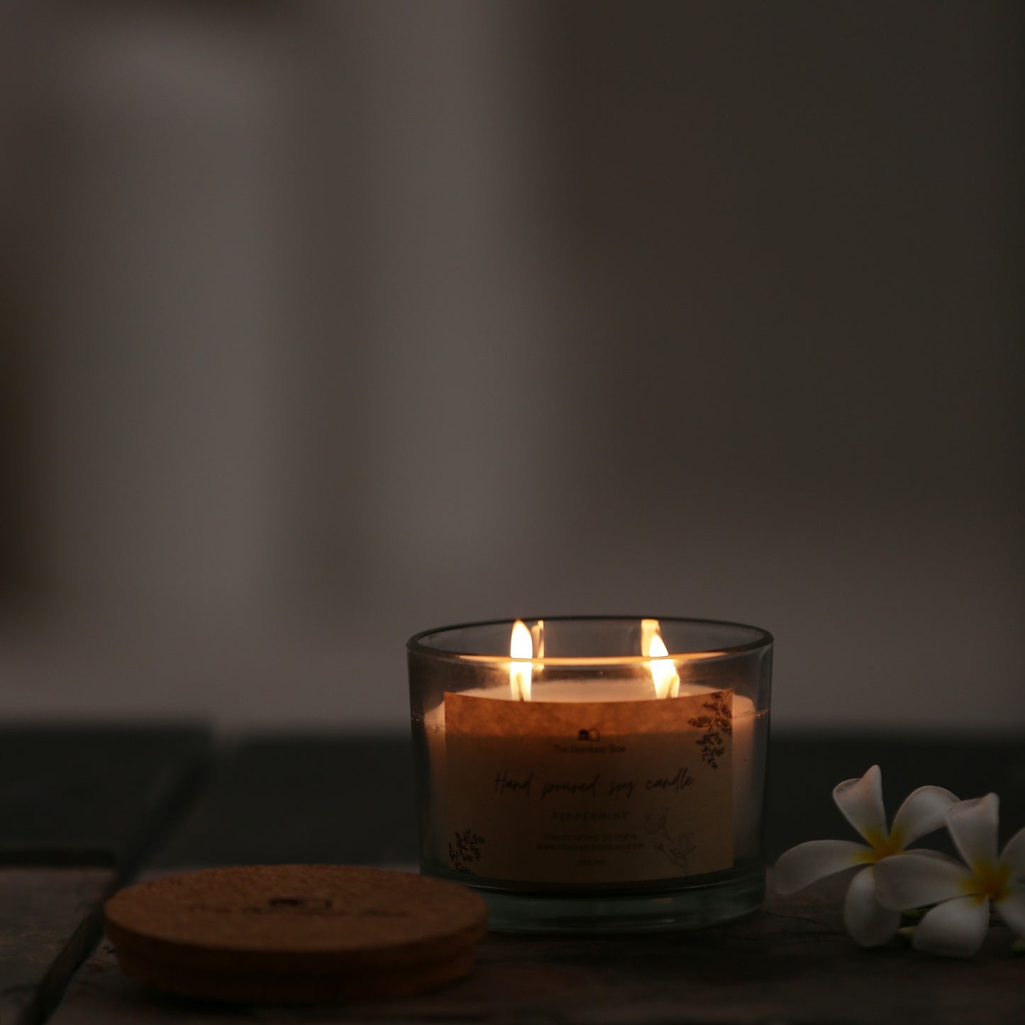 Soy wax candle in reusable glass jar with cork lid – eco-friendly, clean-burning, and perfect for gifting.