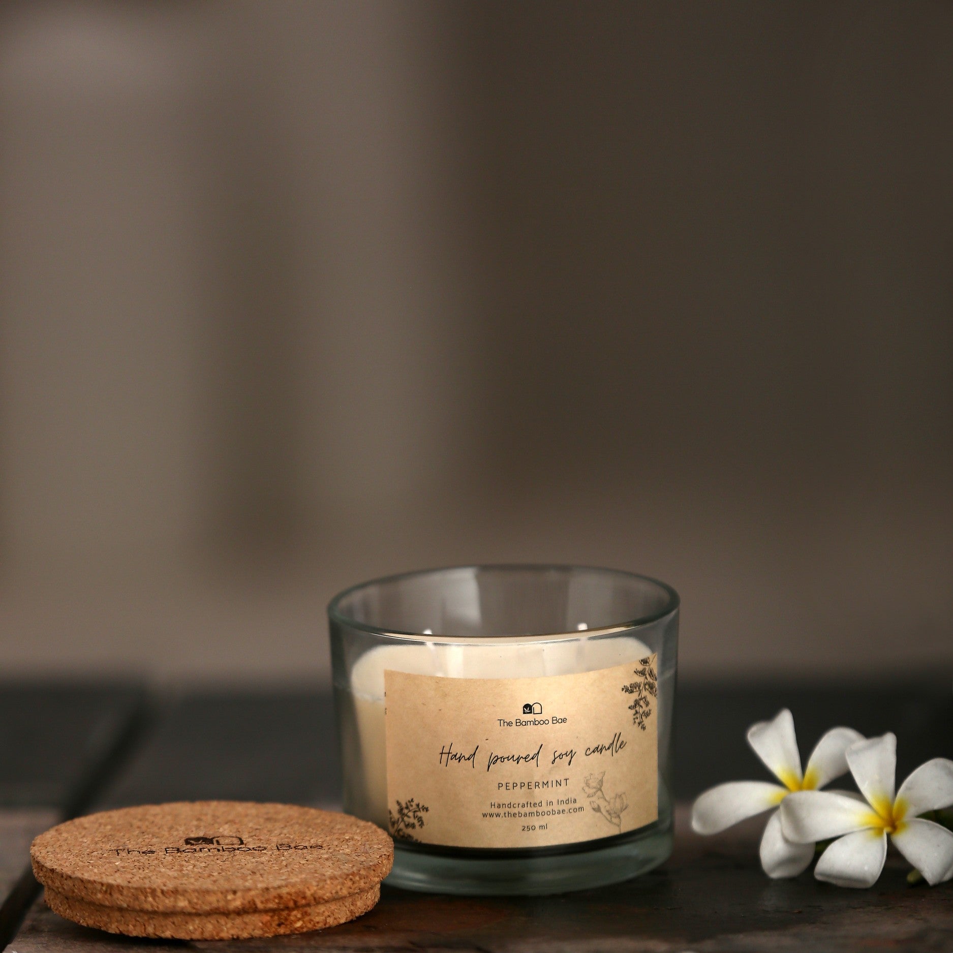 Soy wax candle in reusable glass jar with cork lid – eco-friendly, clean-burning, and perfect for gifting.